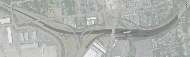 Aerial view of SR 518 from 24th Ave S to 42nd Ave S with multiple connecting ramps, surrounded by buildings, parking lots, and green spaces.