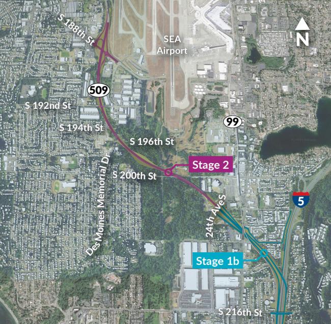 This aerial map shows the route of the new SR 509 expressway between I-5 and South 188th Street in south King County. One stage of construction is show in a blue line from I-5 to 24th Avenue South. The next stage of construction is depicted with magenta line from 24th Avenue South to South 188th Street. Seattle Tacoma International Airport is at top center and the new highway is immediately below it. Houses and buildings are visible throughout the area.